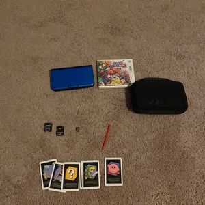 Nintendo blue 3DS, XL with three microSD cards a case and 3ds games